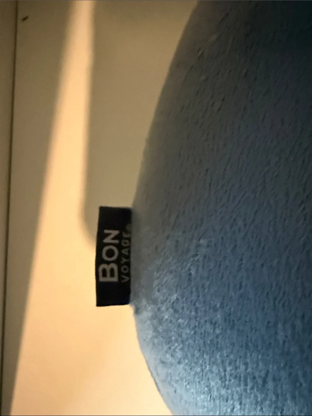 Bon Voyage Travel Plush Neck Pillow in Soft Blue.